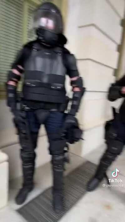 The surreal moment that a Trump supporter begs cops to intervene in the Capitol riots.