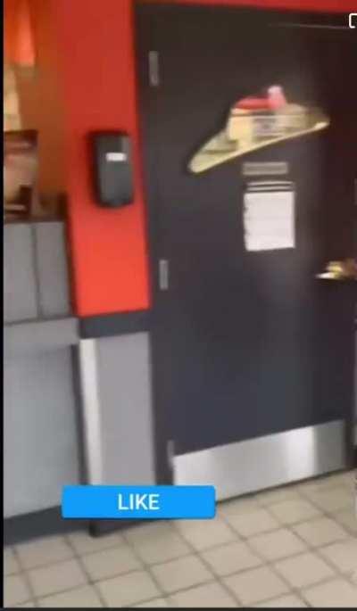 Woman complains about her pizza not having any sauce on it and ends up pushing the pizza box at the employee out of frustration. They both go outside and the employee ends up pushing the customer to the ground.