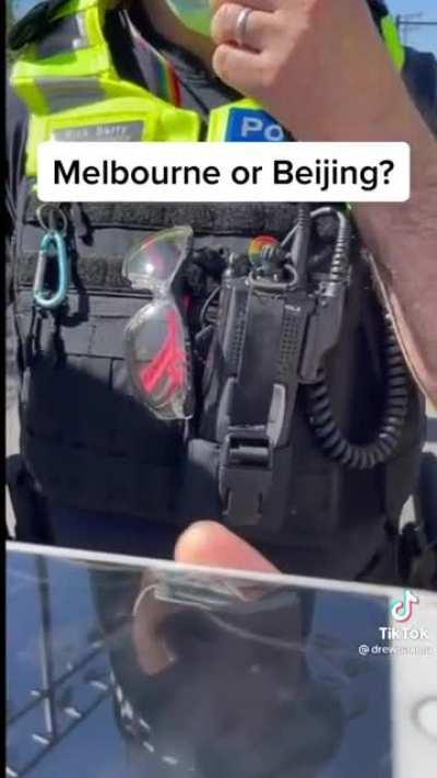 Person asked to remove shirt at the Australian Open tennis for having a political statement written on it