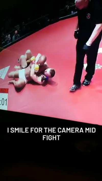 Looking at the camera and smiling mid fight