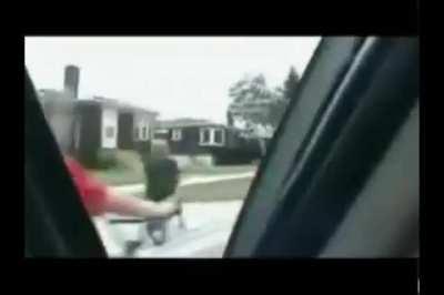 to try and hit a person on a bike with a car door....