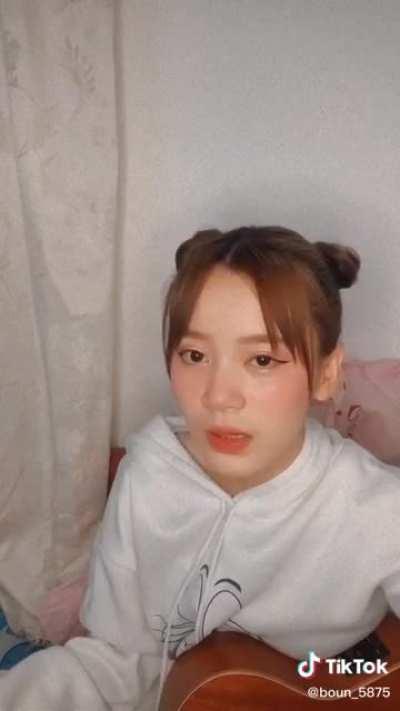 can someone tell me what song is she singing? and is it in thai?