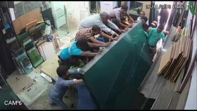 WCGW not being careful while moving glass sheets.