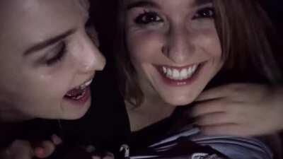 Two girls giving a blowjob in a cinema