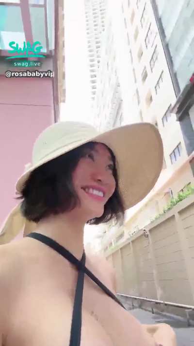 Flashing her boobs to the guy filming her