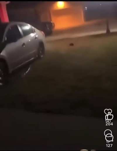 Man somehow escapes being run over, as woman calmly tells him to get in her house.