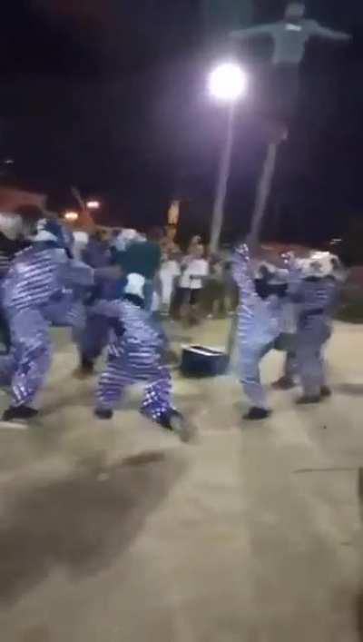 This man enduring pain for a crate of beer.