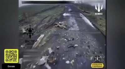Two Russian soldiers on a motorcycle try to escape a Ukrainian FPV quad, but crash while they have to leave the road to evade the wreckage of an armored vehicle, which gives the FPV pilot time to catch up.