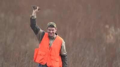 Hunter catches flying bird mid-air with one hand