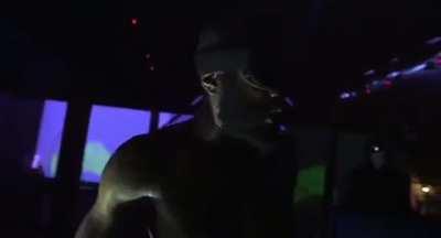 A hyped MC Ride throwing the boiler room camera man off the stage: