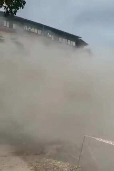 Deconstruction of a five storey building goes wrong as the building falls on the wrong side (Kathmandu, Nepal) September 2020.