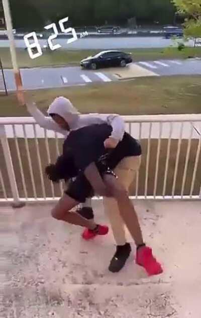 Kid gets tossed off balcony in school