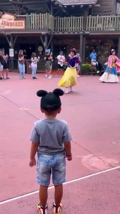 A small kid being respectful for the princesses, Disney's real Prince