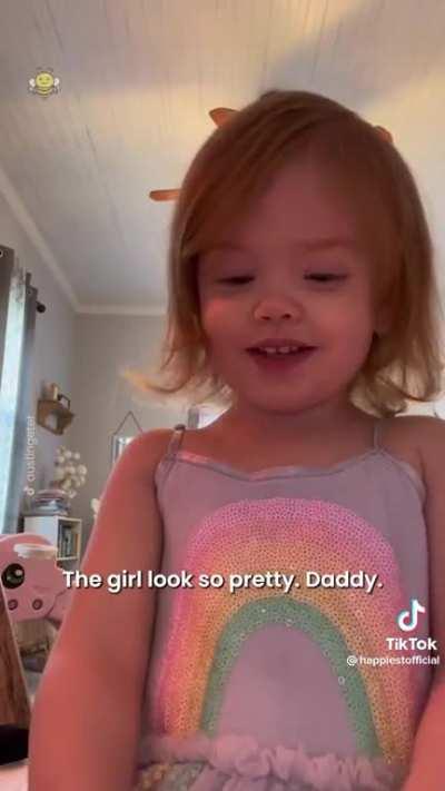Toddler doesn't recognize that she's the pretty girl in the phone