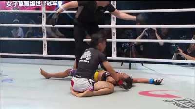 MMA fighter Xiong Jing Nan shows compassion and class by making sure her opponent is okay before celebrating.