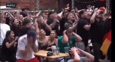 Germans fans celebrating Mullers chance just before he missed it