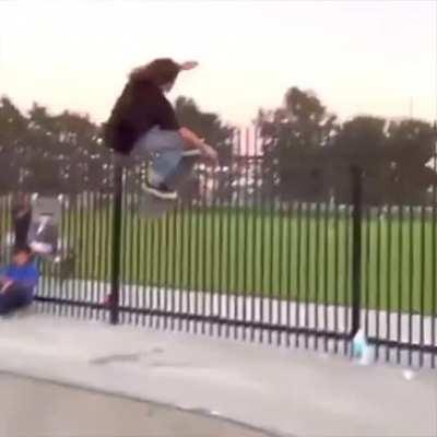 WCGW hopping a fence on a skateboard