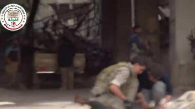 FSA fighters use a classic Toyota Technical, LMGs, and AKs to engage an occupied high rise - Aleppo - 1/27/2015