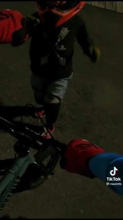 Bmx dude helps out little bro who fell.