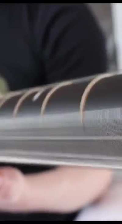 A tech-savvy musician has revealed a rotating guitar. The miracle instrument contains different variations of strings and looks like a minigun.