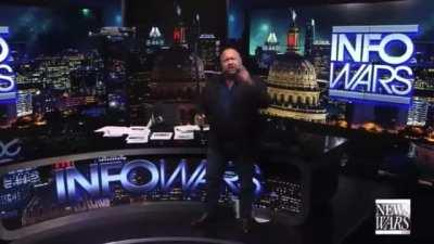 Alex Jones destroys a drone with a sword