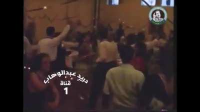 Uday Saddam Hussein going ballistic, firing his rifle indoors at his birthday party.