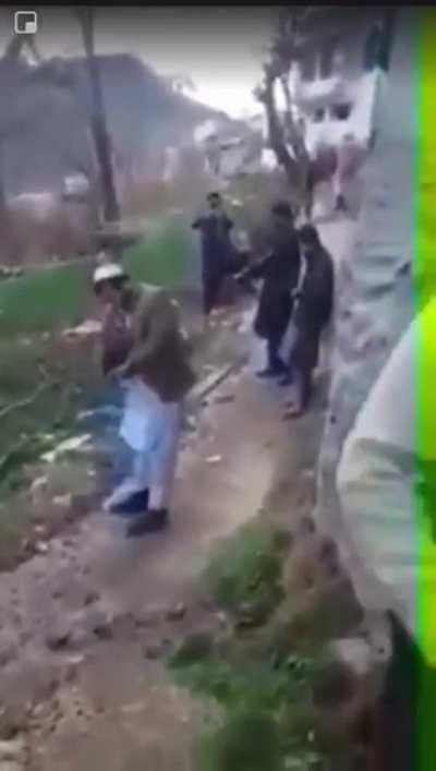 WCGW holding a rifle between the legs