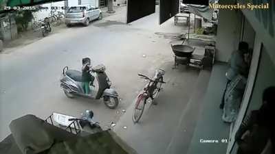child tries to steal a moped