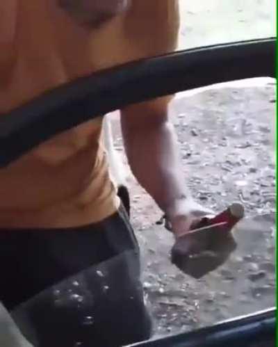 Using your car window to open a bottle