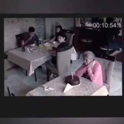 This lady is celebrating her birthday alone in a cafe, and then the people there accompany her