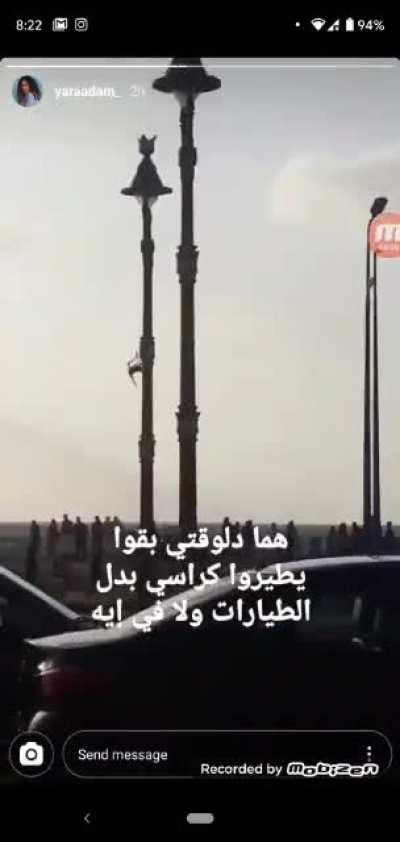 this guy flying a plastic chair in egypt