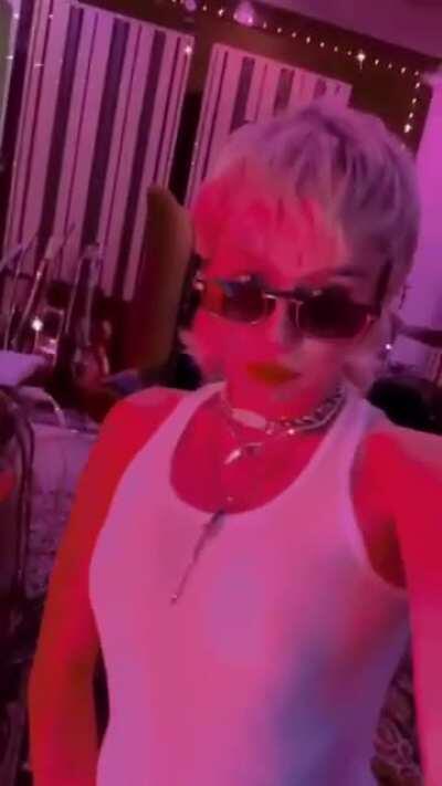 Miley listening to music in a see through top!