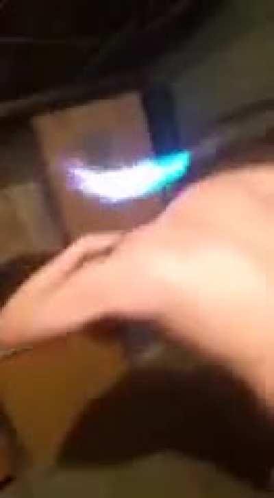 By blow torching your head.