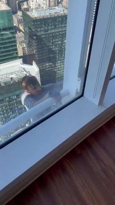 Man climbing the salesforce tower in San Francisco