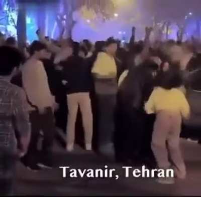 Lots of Iranian women celebrating without their hijabs, whipping their hair around