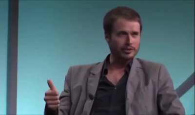 Elon nervously laughing as his brother Kimbal says, 