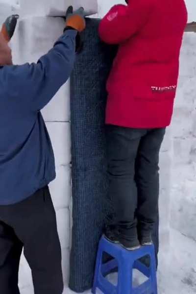 building a snow house from snow bricks