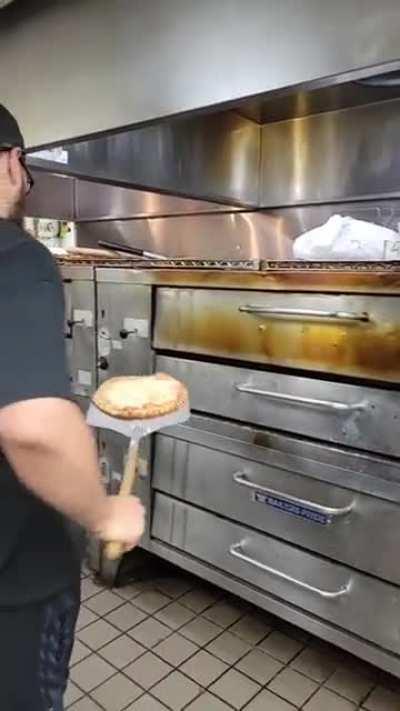 flipping the pizza