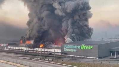 Local mall burning down due to current unrest in Pietermaritzburg, South Africa