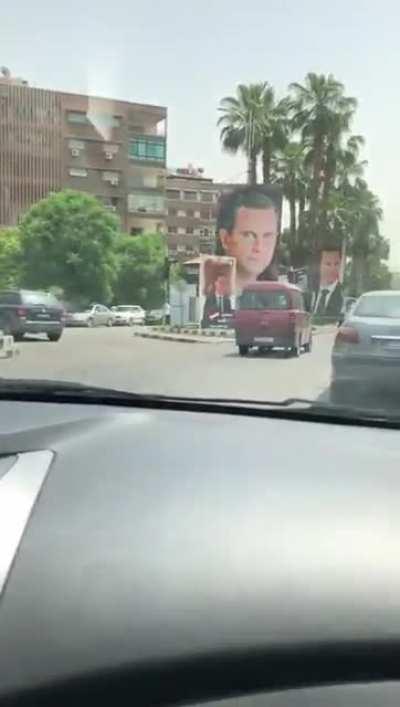 A tour in Damascus: imagine how much each of these colored posters cost for an election whose results are already known in a country going through acute economic devastation