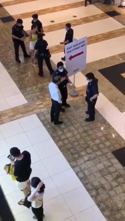 A woman got handcuffed in the public, can hear her asking where is the human right ?