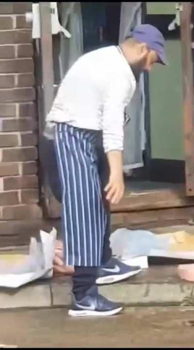 This is a man preparing meat for the public to purchase in London.