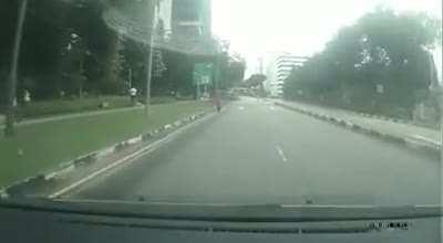 cyclist makes abrupt turn infront of car and then proceeds through red light