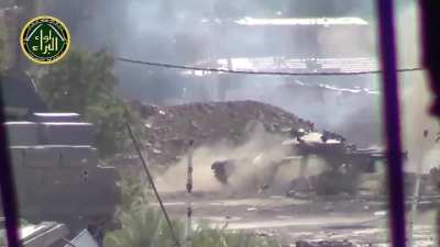 Clear version of the Syrian Army tank lobbing a shell near directly at the Opposition camera - 2014