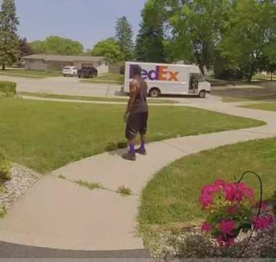 FedEx driver cools down with sprinklers