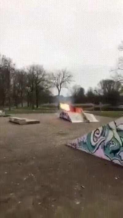 Firecracker surrounded by bottles of gasoline