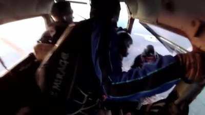 Aeroplane full of skydivers crashes with another plane in the sky.