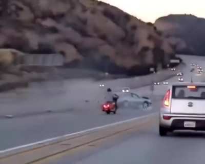 Instant mayhem! Who’s at fault here? Biker or the car? 