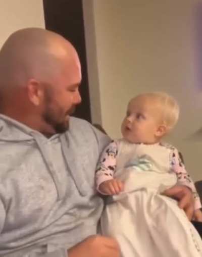 Baby trying to process dad’s new haircut