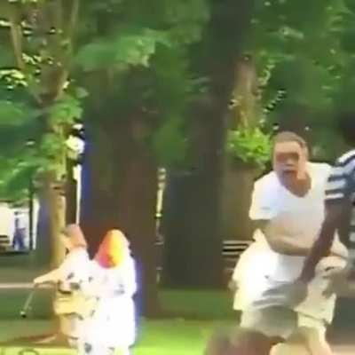 Messing with a kid on a skateboard